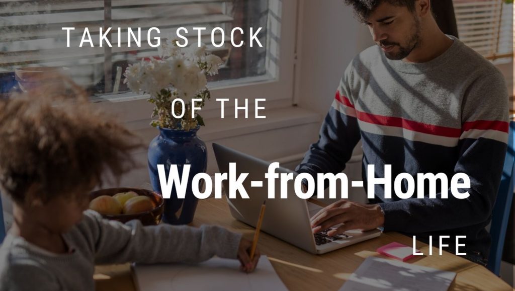 A father and son work work at a kitchen table with text overlaid: Taking stock of the work-from-home life.